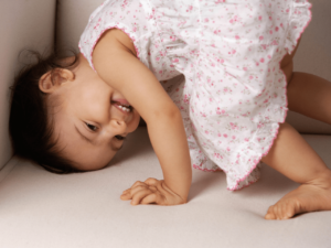 cute toddler doing a hand stand