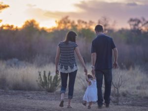 family walking together, mum dad and child