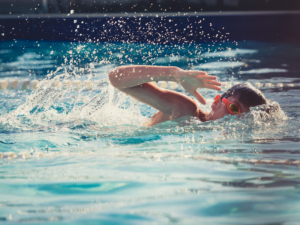 young person with a disability swimming